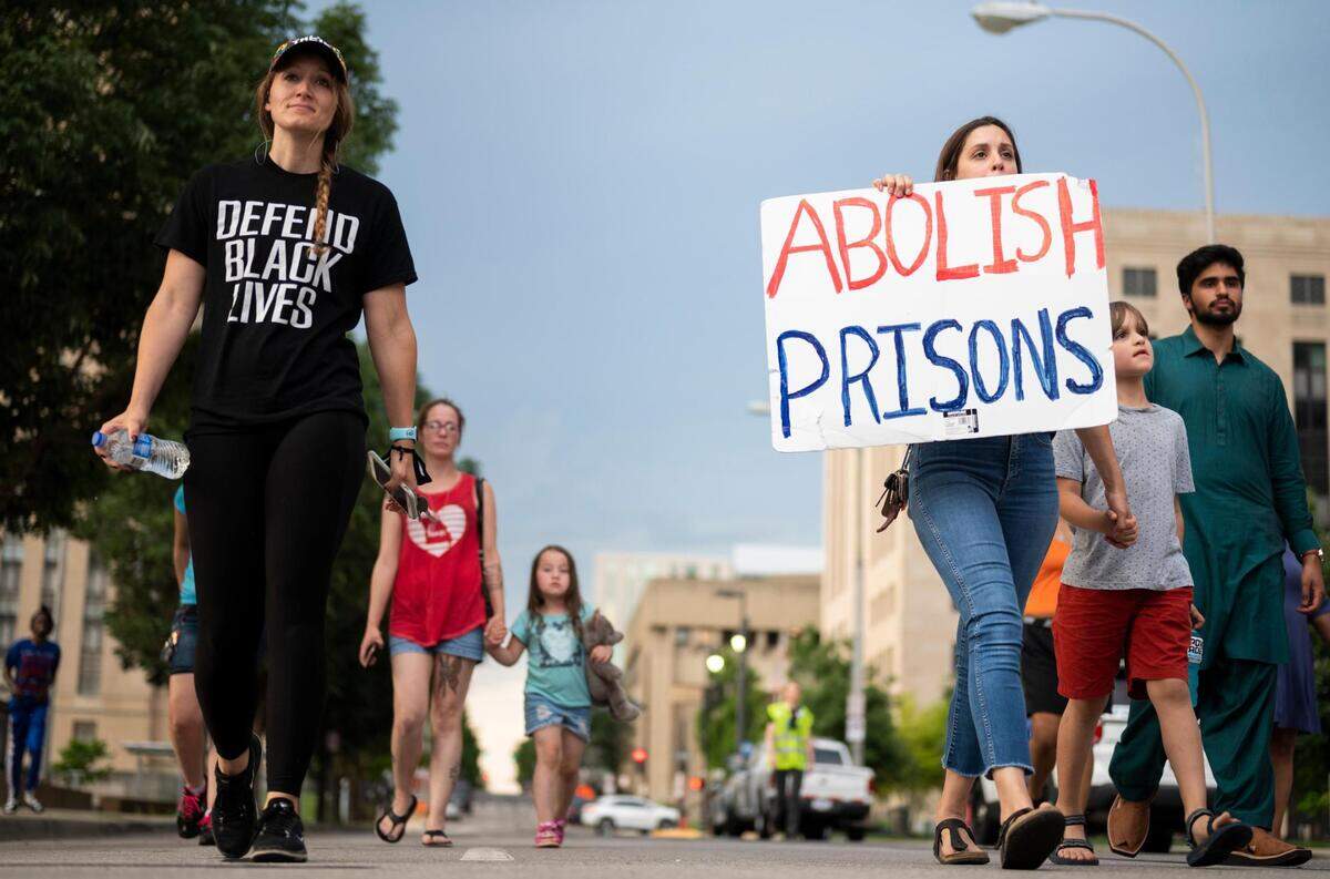 People protest officer involved shootings and killings on June 10, 2022, by marching from the Kansas City Police Department Headquarters to the Jackson County Detention Center in Kansas City. This marks the two-year anniversary of the creation of Friday night protest, a weekly demonstration that began in the wake of George Floyd’s death in police custody in Minneapolis.