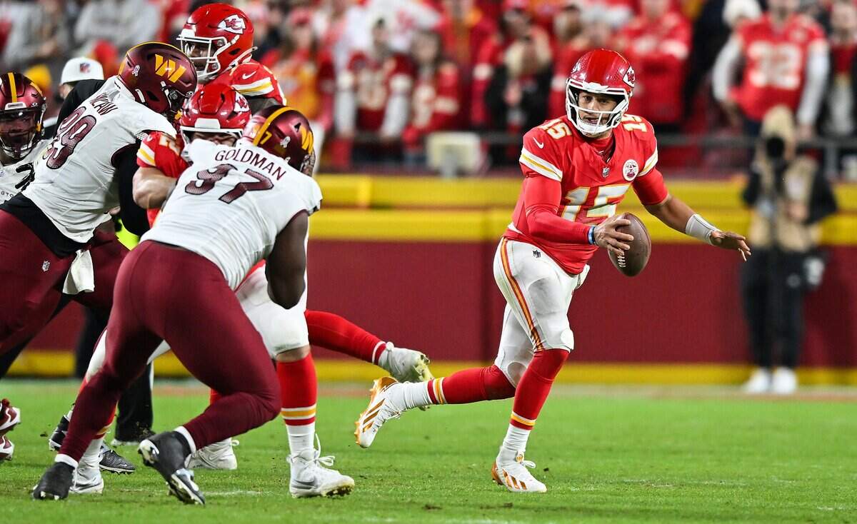 Kansas City Chiefs quarterback Patrick Mahomes (15) scrambles to look for an open receiver in the second half against the Washington Commanders on Monday, Oct. 27, 2025, at GEHA Field at Arrowhead Stadium.