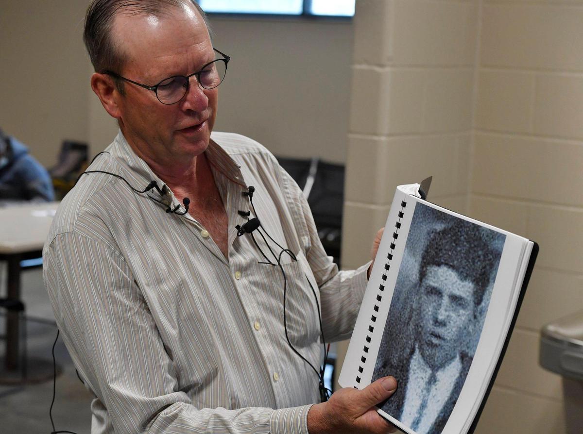 While speaking to the media Tuesday afternoon, Robin Deeds, a second cousin of the late Wilbur F. Newton, holds up a high school senior picture of the Seaman First Class, who was killed December 7, 1941 while stationed on the U.S.S. Oklahoma at Pearl Harbor. Newton’s remains were returned to Missouri aboard a flight which arrived Tuesday, May 24, 2022, at KCI. A U.S. Navy Reserve Honor Guard carried Newton’s remains to a hearse which was then escorted to his hometown of Mound City, where he will be buried. Newton’s remains were identified earlier this year through DNA testing. His remains have been interred in Hawaii since 1941.