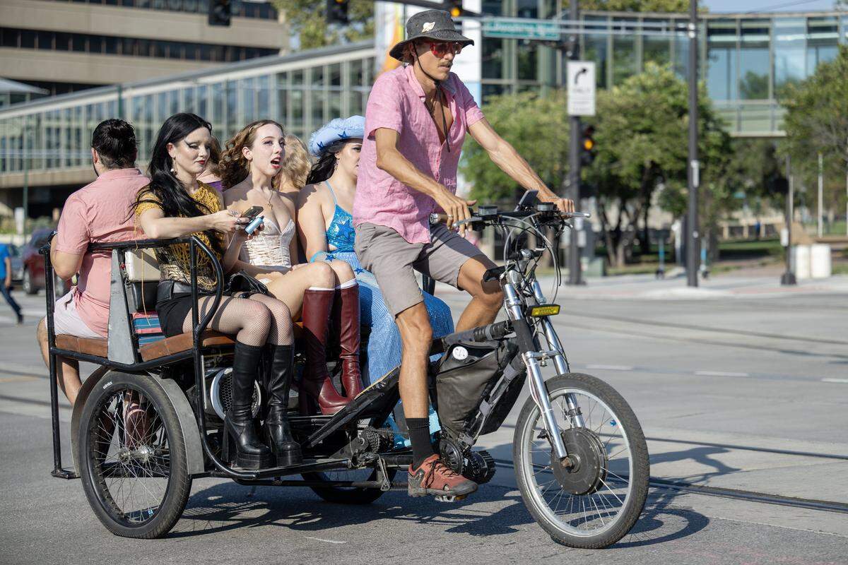 Chappell Roan fans to a pedicab to the concert venue on the lawn the National World War I Museum and Memorial on Friday, October. 3, 2025, in Kansas City.