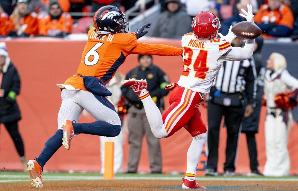 Kansas City Chiefs wide receiver Skyy Moore (24) misses a catch as Denver Broncos safety P.J. Locke (6) defends during an NFL football game at Empower Field at Mile High on Sunday, Oct. 29, 2023, in Denver.