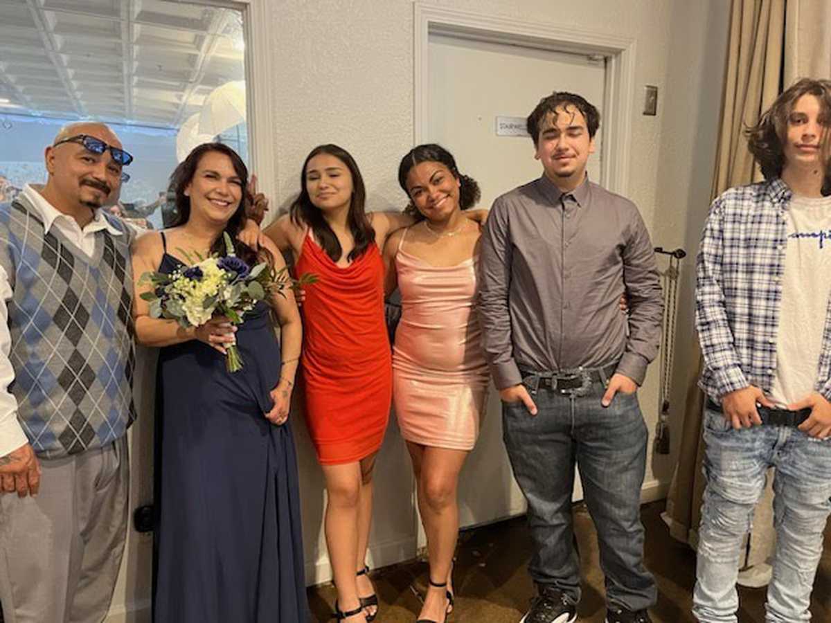 George Abasta, smiles for a picture with his wife, Celeste Lamar, and their children, Brenee, Naquia, Triston and Israel. Abasta, 50, an Olathe father of six, was allegedly hit and killed by a semi-truck driver on Oct. 9, 2023, after trying to cross I-435 near Metcalf Avenue after he was involved in a car wreck. The truck driver, Overland Park police said, did not stop.