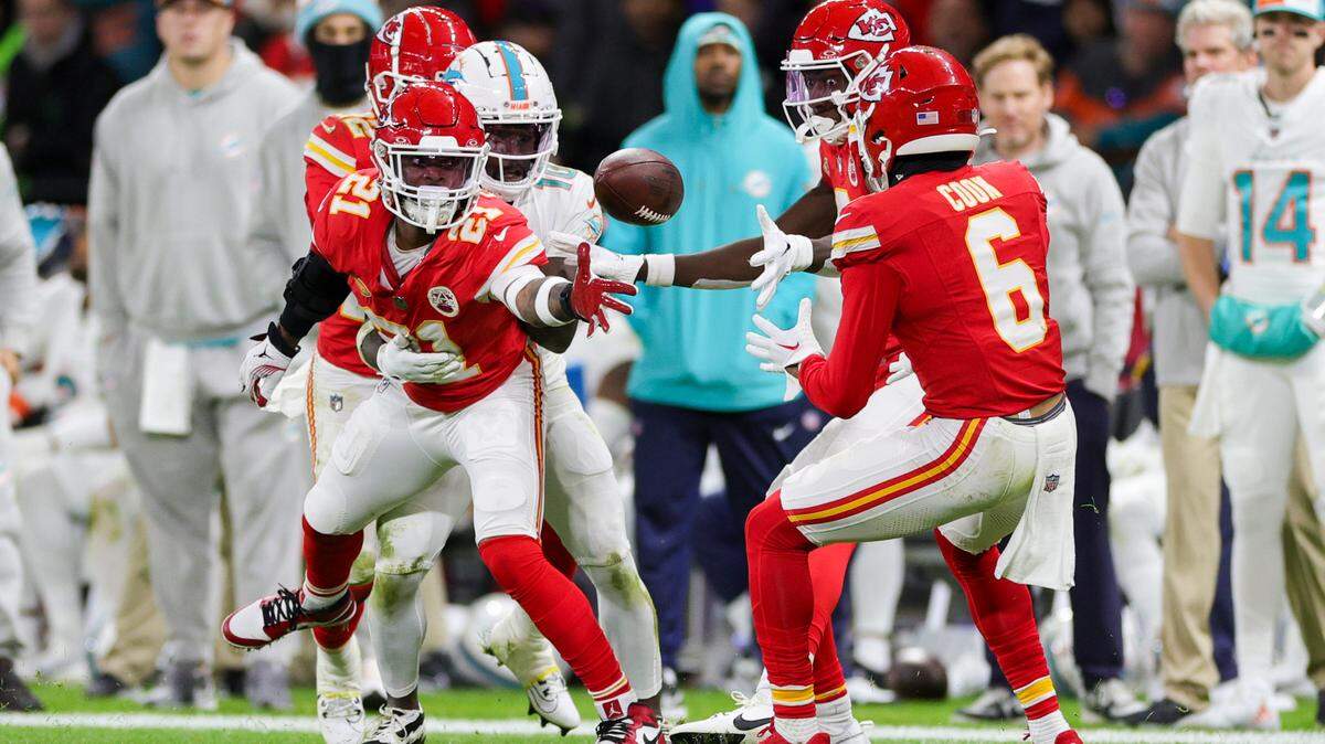 Nov 5, 2023; Frankfurt, Germany, ; Kansas City Chiefs safety Mike Edwards (21) tosses the ball back to safety Bryan Cook (6) against the Miami Dolphins in the second quarter during an NFL International Series game at Deutsche Bank Park. Mandatory Credit: Nathan Ray Seebeck-USA TODAY Sports