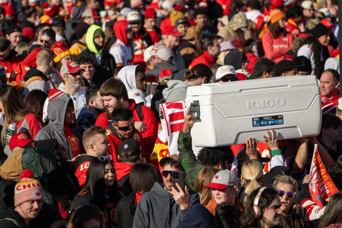 Please pass the beer. Chiefs fans passed a cooler above the crowd before the Super Bowl LVIII championship parade and rally on Wednesday, Feb. 14, 2024, in Kansas City.