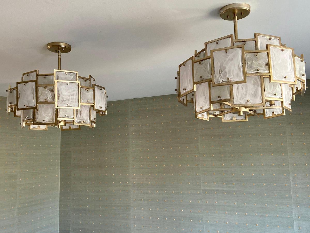 Tamara Day said she used square shapes — in the light fixtures and wallpaper — in designing the dining room of a Leawood home.