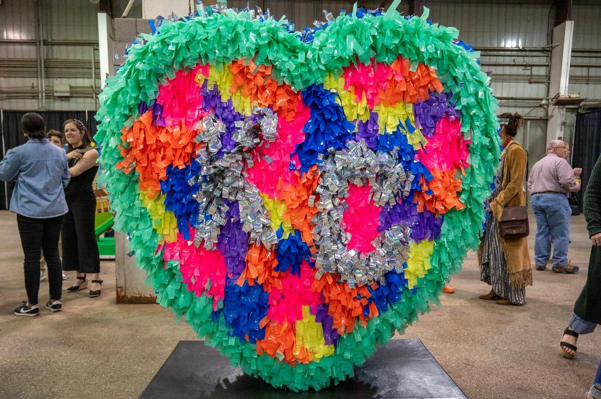 “Hearty Party” by artist Abigael Elliott is displayed during the Parade of Hearts reveal kickoff event at the American Royal Hale Arena on Friday, April 12, 2024, in Kansas City.