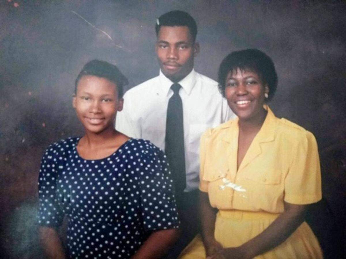 Lamar Johnson poses for a family photo with his sister, Candice Johnson, left, and his mother, Mae Johnson, in the 1990s before he was arrested for a fatal shooting that St. Louis’ circuit attorney now says he did not commit.
