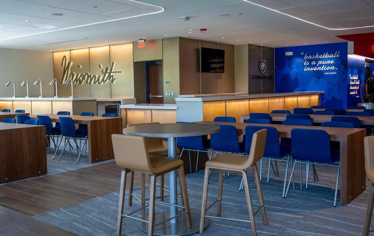 Updated graphics featuring James Naismith adorned the wall in The Naismith Room, a hospitality area, at Allen Fieldhouse. The renovations were were seen during a media tour on Friday, Oct. 18, 2024, in Lawrence.