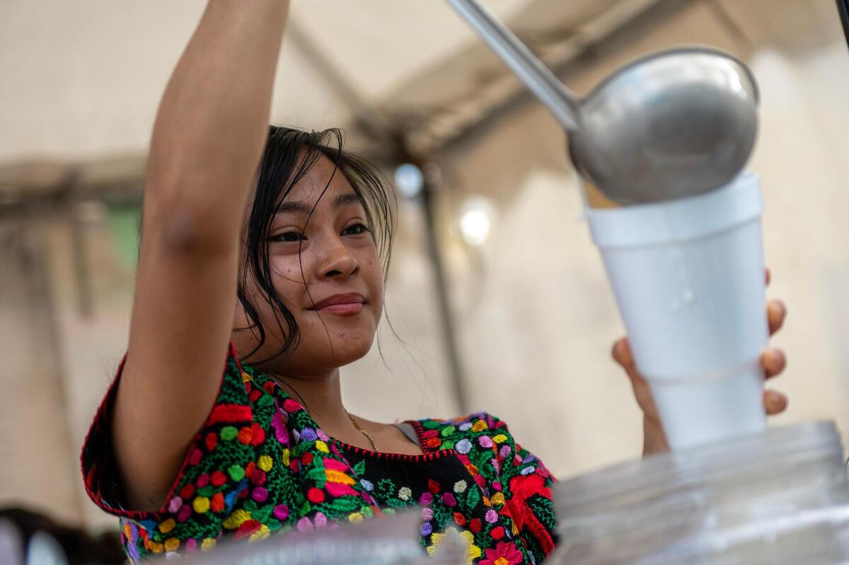 Yani Hernandez, prepares a horchata drink for a guest during the Cinco de Mayo celebration at Guadalupe Centers on Friday, May 5, 2023, in Kansas City.