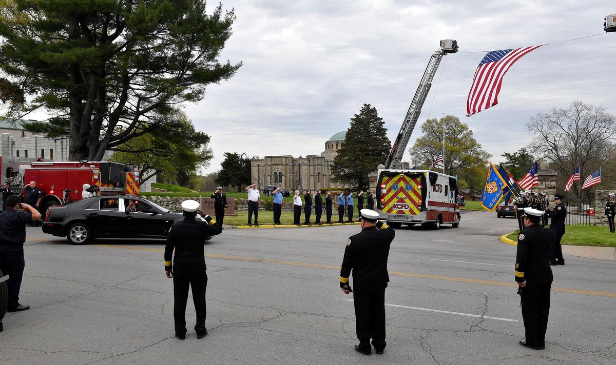 As the funeral procession for Billy Birmingham entered the Forest Hills Cemetery, a woman leaned out of a car window and thanked those paying their respects to the fallen EMT. Birmingham, who was a Kansas City, Missouri, Fire Department EMT, died April 13th from COVID-19 complications. He had worked for Mast Ambulance Service since 1998. He was the first city employee to die from COVID-19.