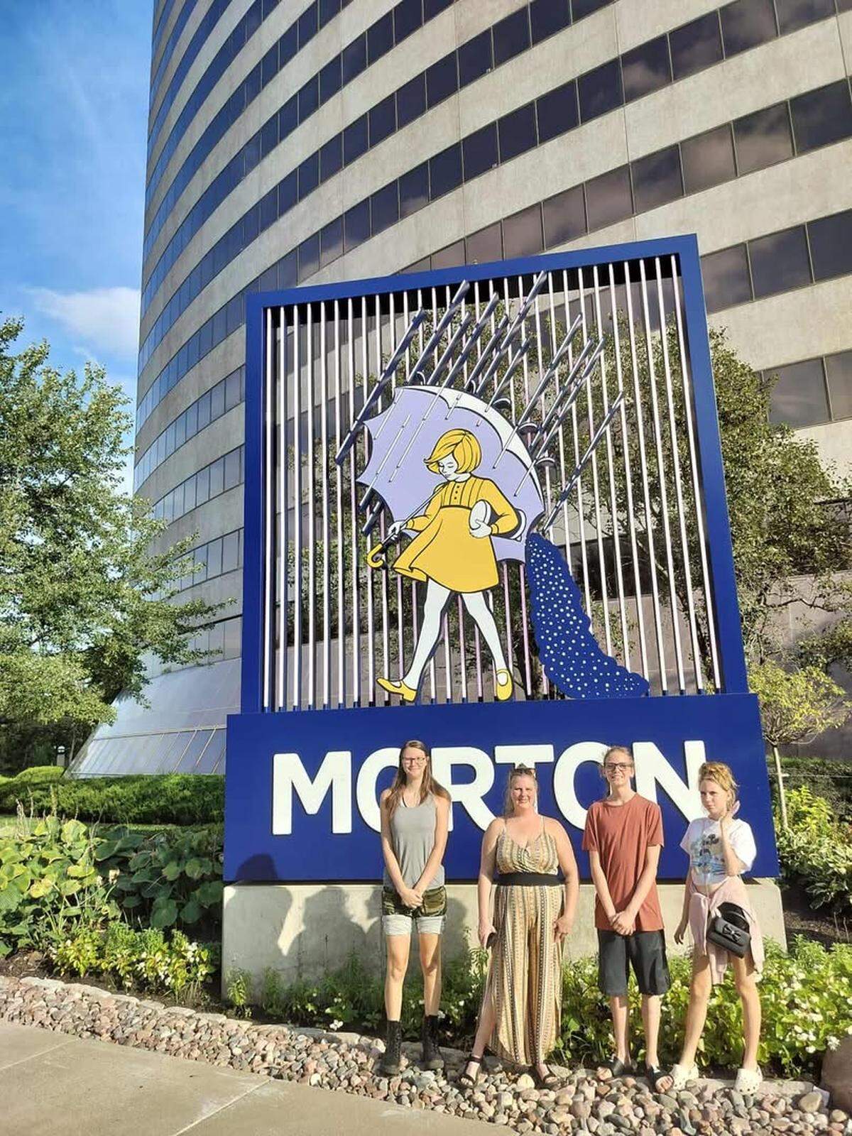 The Manz family, left to right: Nevaeh, mom Kat, Gage and Emma, standing in front of the Morton Salt headquarters in Corporate Woods in Overland Park.