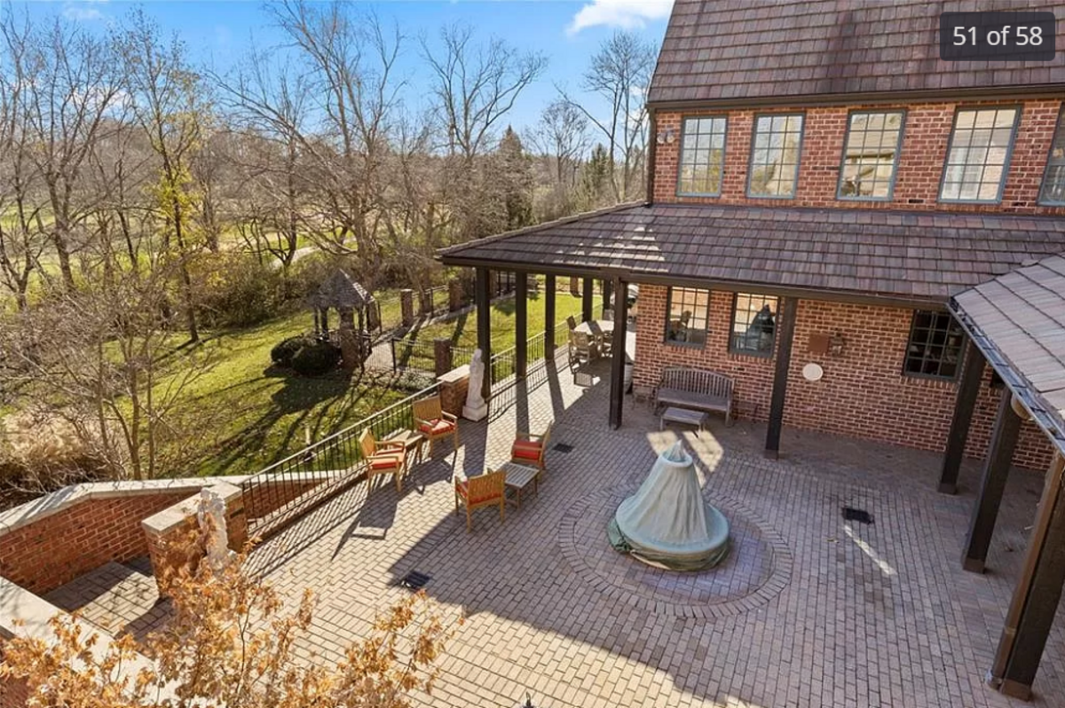 The back patio courtyard of the home for sale at 11409 Meadow Lane in Leawood is seen in this listing photo.