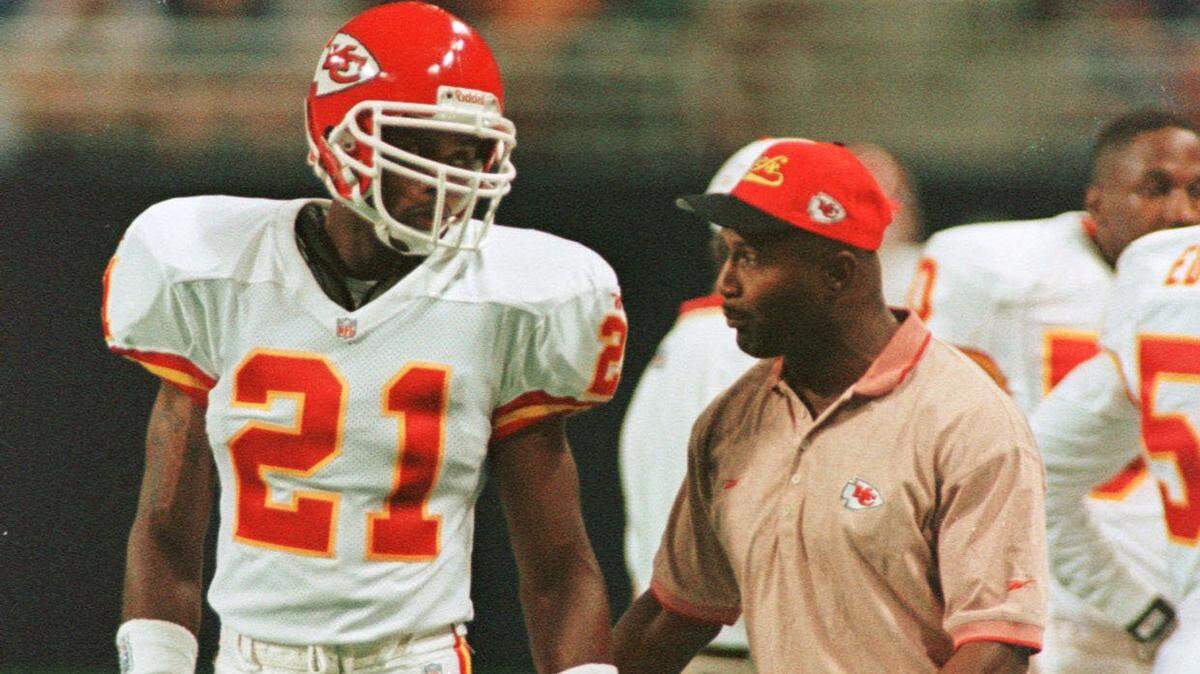 (STAFF/JOE LEDFORD) Kansas City Chiefs defensive players Kevin Ross (right) talked with Jerome Woods during a time out at the game against the St. Louis Rams August 22, 1997 at the Trans World Dome. (Staff/Joe Ledford)