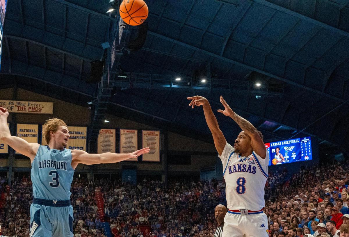 Kansas Jayhawks guard David “Diggy” Coit (8) shoots the ball past Washburn Ichabods guard Jake Schadegg (3) in the first half on Tuesday, Oct. 29, 2024, in Allen Fieldhouse in Lawrence.
