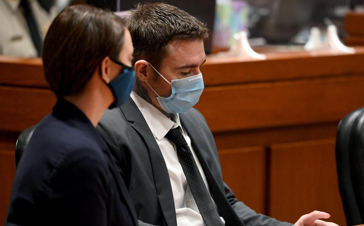 Kylr Yust and attorney Molly Hastings sit at the defense table after the judge informed Yust of the jury’s sentencing recommendations. The jury in the Kylr Yust murder trial recommended a sentence of 15 years for voluntary manslaughter of Kara Kopetsky and a life sentence (30 years) for the second-degree murder of Jessica Runions at the Cass County Justice Center Friday, April 16, 2021. Sentencing is set for June 7.
