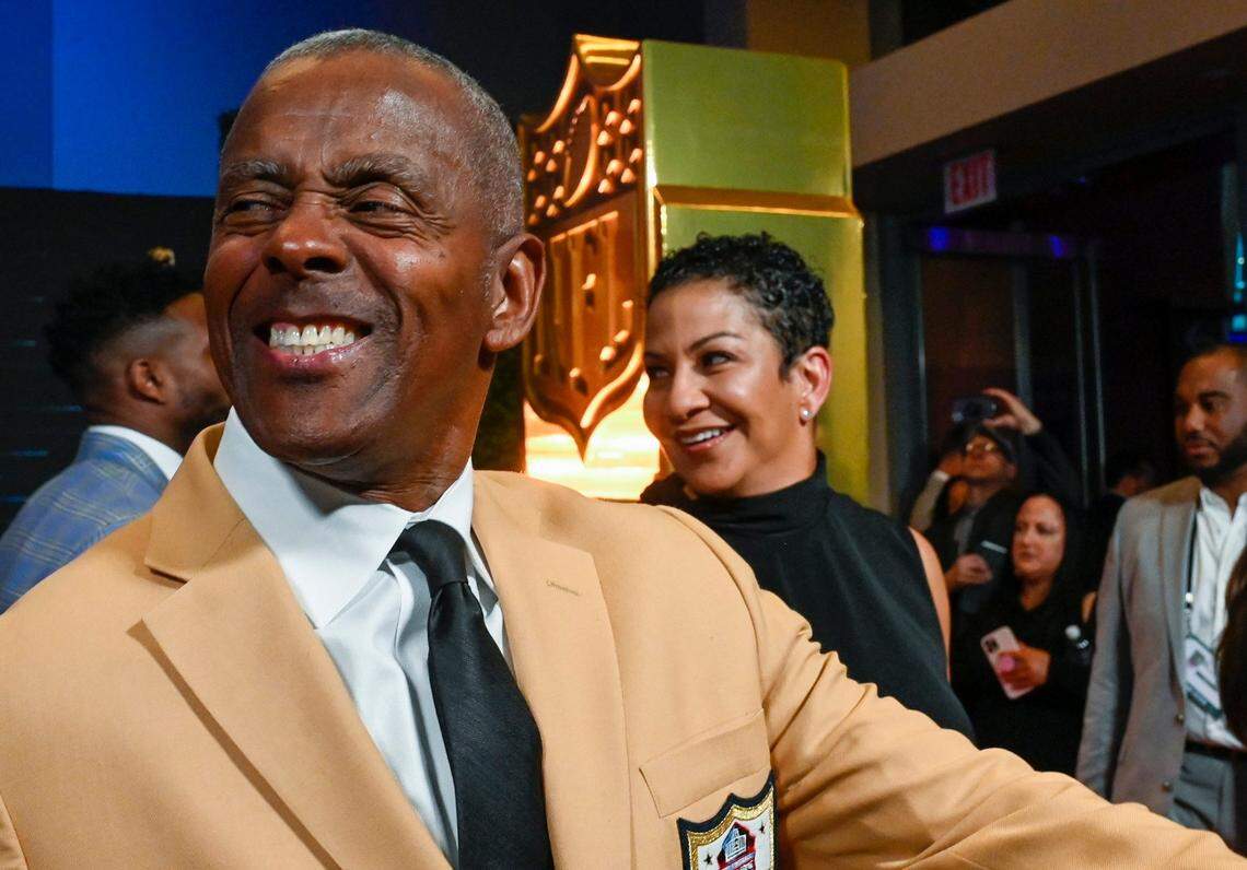 Pro football Hall of Famer Tony Dorsett shares a laugh with his wife, Janet Harmon Dorsett, as they ponder what song Rihanna will sing first during the halftime show at Super Bowl LVII on Sunday. Dorsett walked the red carpet at Thursday night’s NFL Honors show in Phoenix.
