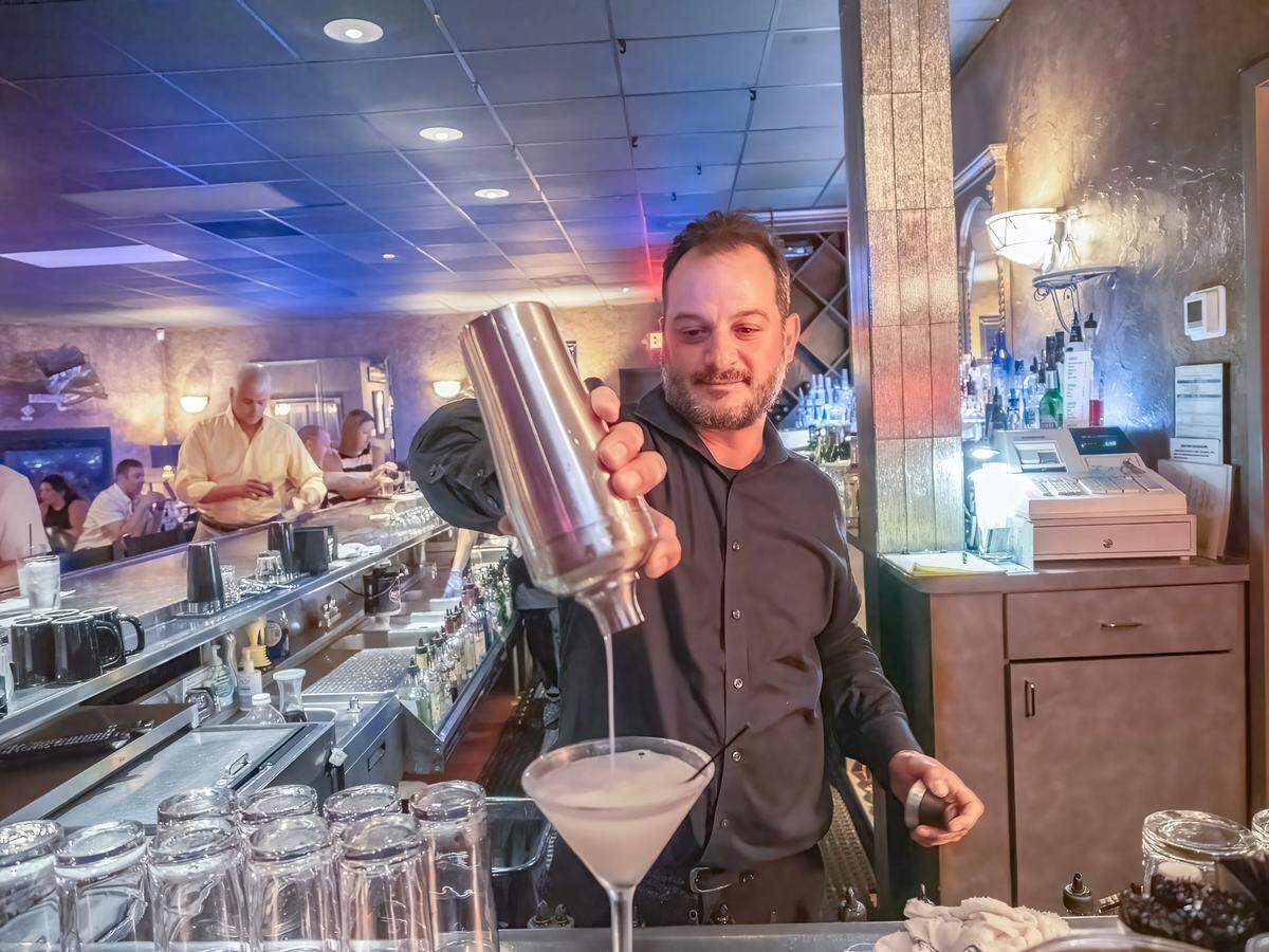 Bartender Sam Zicarelli, master mixologist, works his magic at Touche.