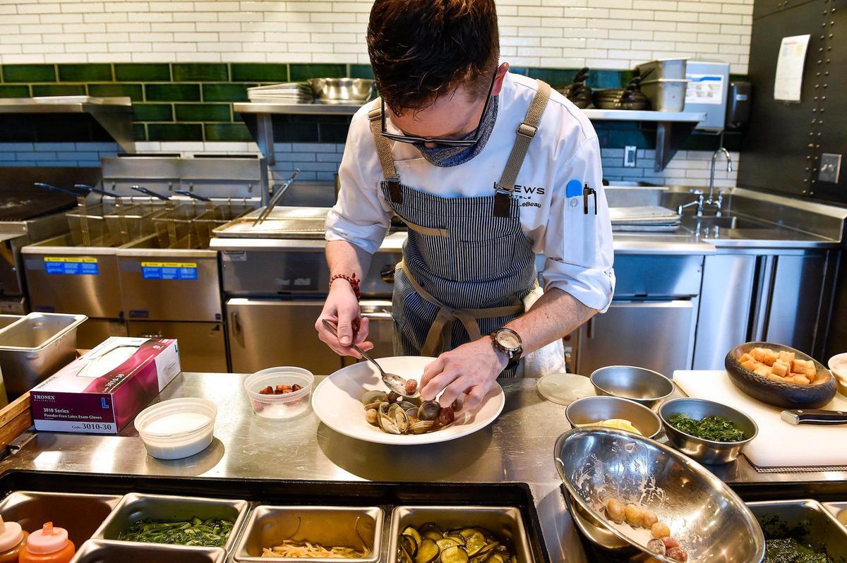 Patrick LeBeau, chef de cuisine at The Stilwell, plates a clam “chowder” dish.