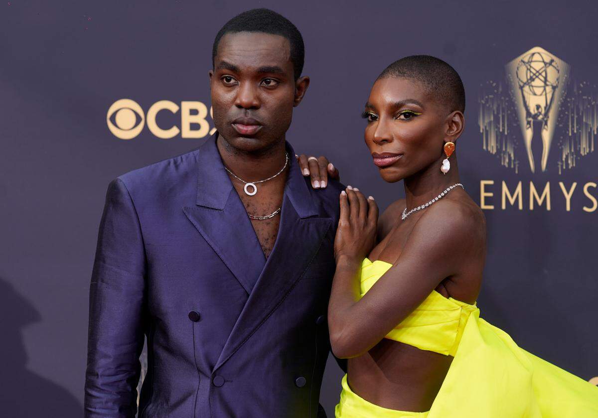 Paapa Essiedu, left, and Michaela Coel arrive at the 73rd Primetime Emmy Awards on Sunday, Sept. 19, 2021, at L.A. Live in Los Angeles. (AP Photo/Chris Pizzello)
