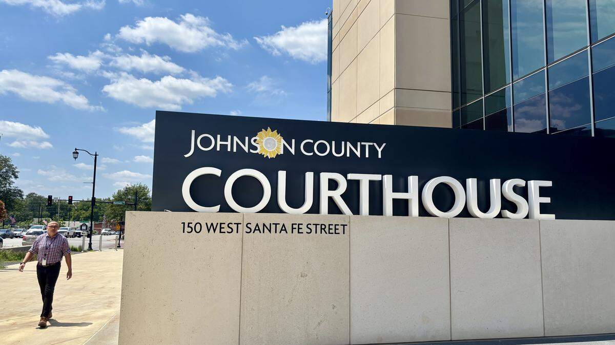 A pedestrian walks by the Johnson County District Courthouse in Olathe on Aug. 4, 2025. Justin Brace, executive director of Trans Heartland, was ordered to pay back the aproximately $11,700 in misused donations, which will be given to another non-profit with a similar mission.