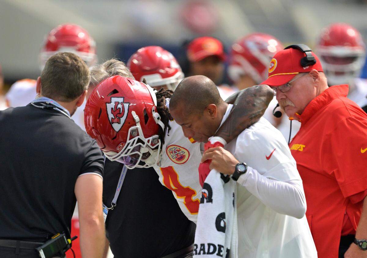 Kansas City Chiefs wide receiver Rashee Rice (4) is assisted by medical staff after an injury in the first half against the Los Angeles Chargers at SoFi Stadium.