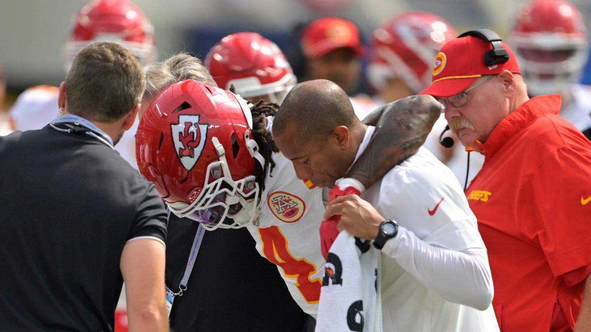 Kansas City Chiefs wide receiver Rashee Rice (4) is assisted by medical staff after an injury in the first half against the Los Angeles Chargers at SoFi Stadium.