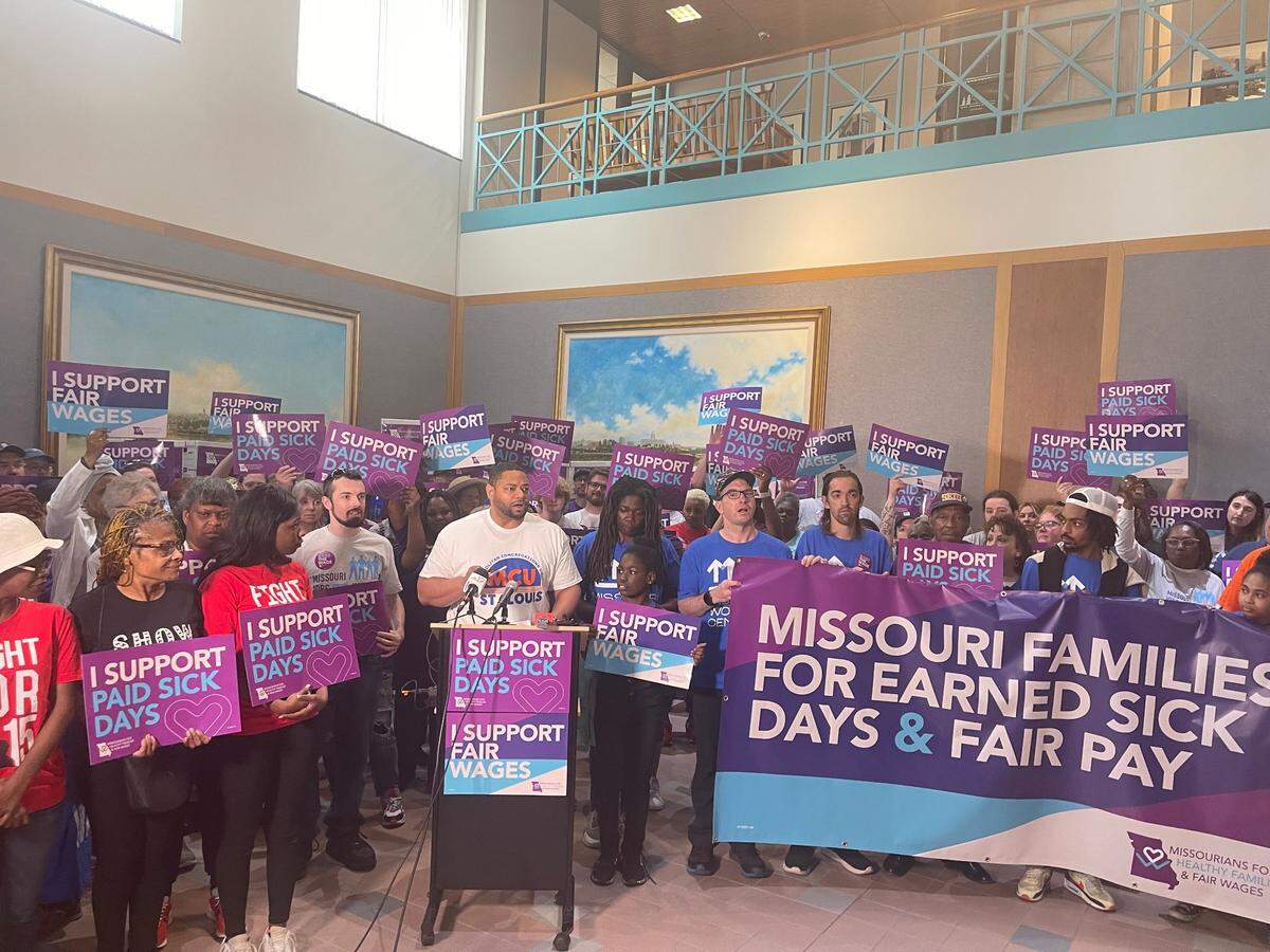 DeMarco Davidson, the executive director of Metropolitan Congregations United, stands with supporters of an effort to raise Missouri’s minimum wage in Jefferson City on May 1, 2024.