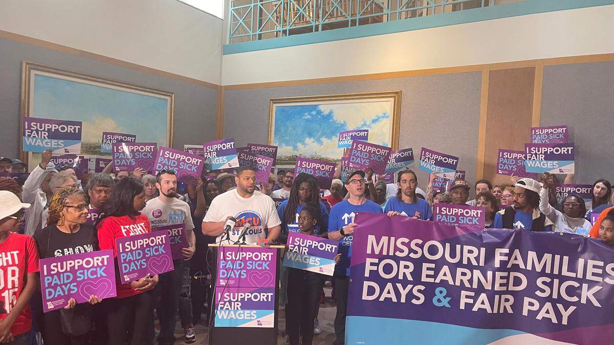 DeMarco Davidson, the executive director of Metropolitan Congregations United, stands with supporters of an effort to raise Missouri’s minimum wage in Jefferson City on May 1, 2024.