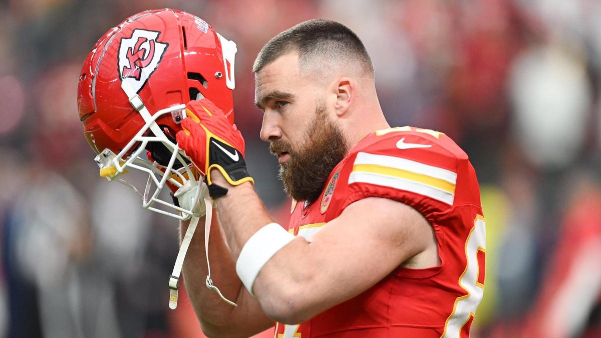 Kansas City Chiefs tight end Travis Kelce (87) puts on his helmet during warm ups before Super Bowl LVIII, Sunday, Feb. 11, 2024, in Las Vegas.