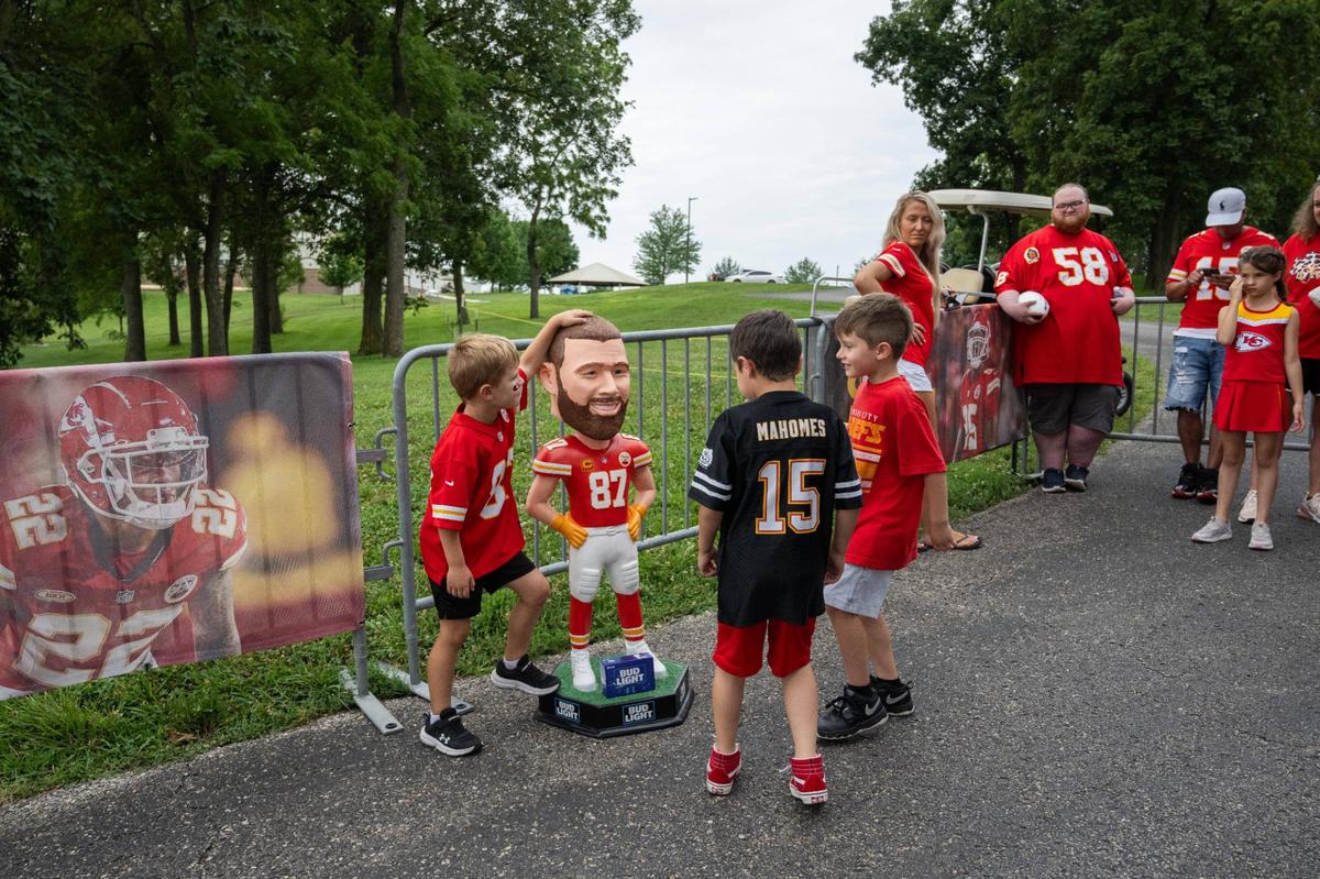 Fans interact with a ‘life sized’ Travis Kelce bobblehead at Chiefs camp on Sunday, July 21, 2024, in St. Joseph.