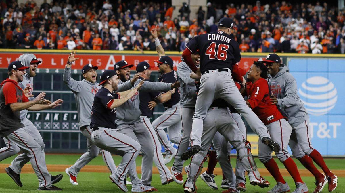 The Washington Nationals celebrate after their Game 7 win over the Houston Astros at Minute Maid Park.