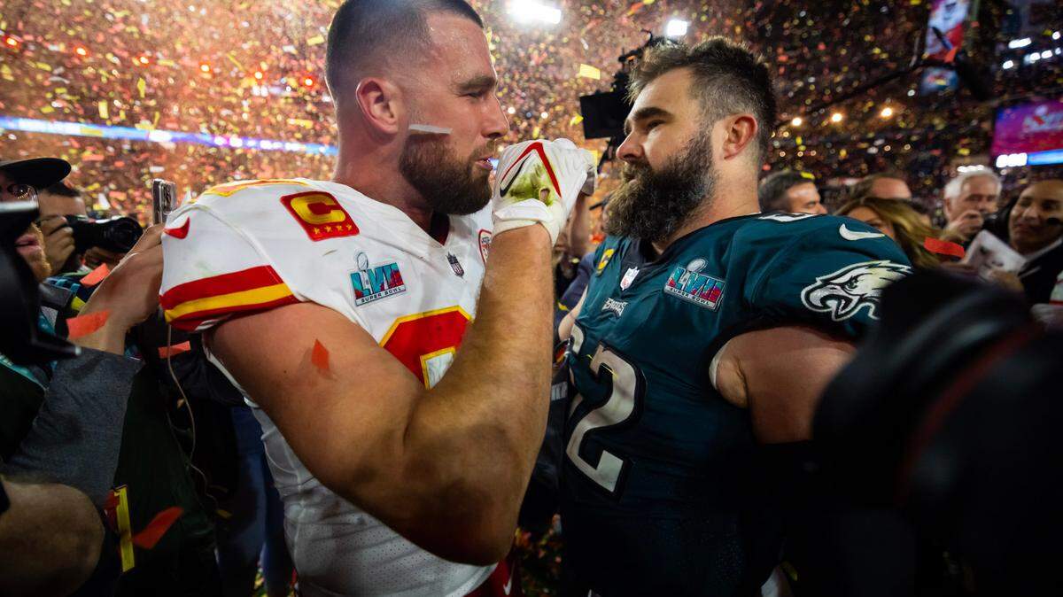 Feb 12, 2023; Glendale, Arizona, US; Kansas City Chiefs tight end Travis Kelce (87) talks with his brother Philadelphia Eagles center Jason Kelce (62) after Super Bowl LVII at State Farm Stadium.