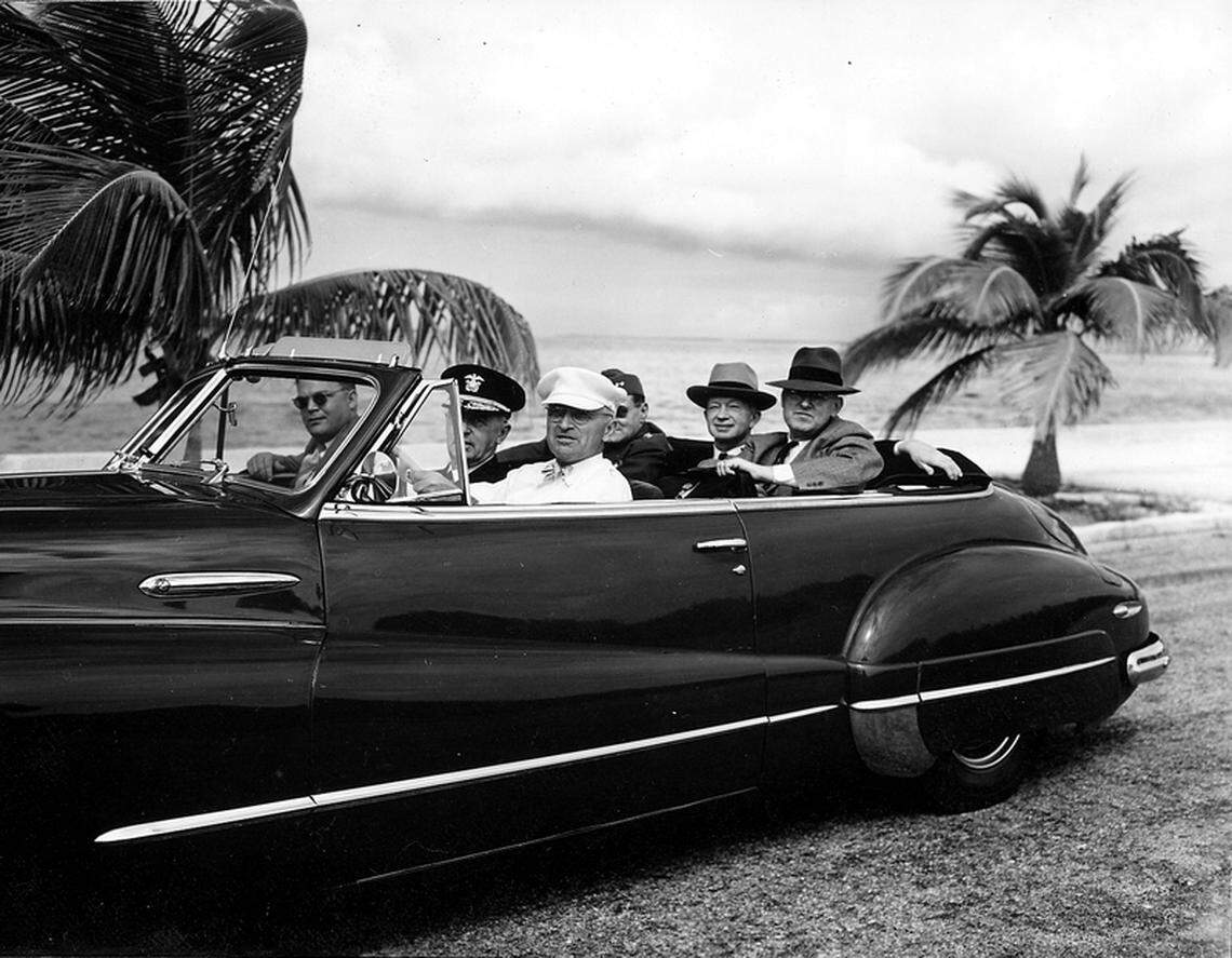President Harry S. Truman stops the motorcade at a scenic spot on the highway to Key West, Florida, after going to Boca Chica to meet additional guests who arrived late. In the front seat, from lef: unidentified, Adm. William Leahy, Truman. Back seat, from left: Harry Vaughan, Judge John Caskie Collet and John Steelman. From the album “The President’s Trip to Key West, Florida.”