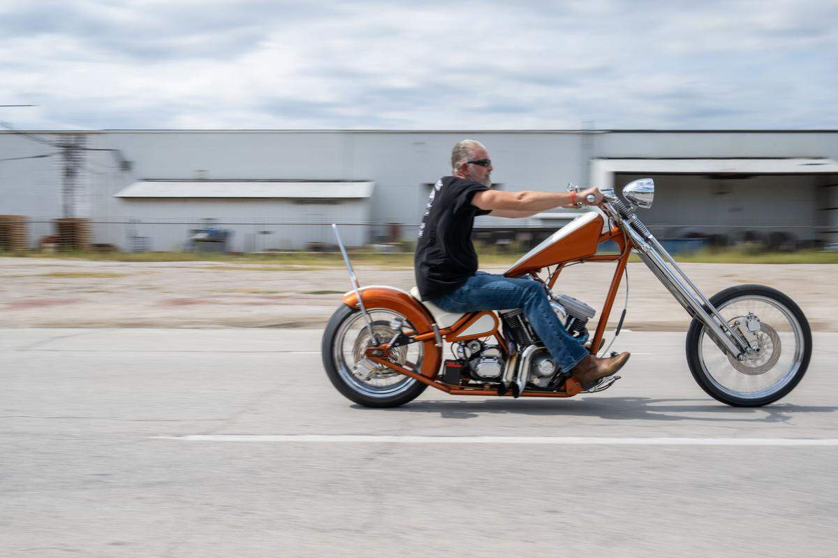 An attendee of The David Mann Chopper Fest rides his chopper away Saturday after attending the event. 
