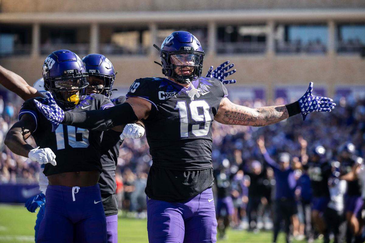 TCU Horned Frogs tight end Jared Wiley (19) and wide receiver Dylan Wright (16) celebrate after Wiley scores a touchdown against BYU during the game at Amon G. Carter Stadium on Oct. 14, 2023.