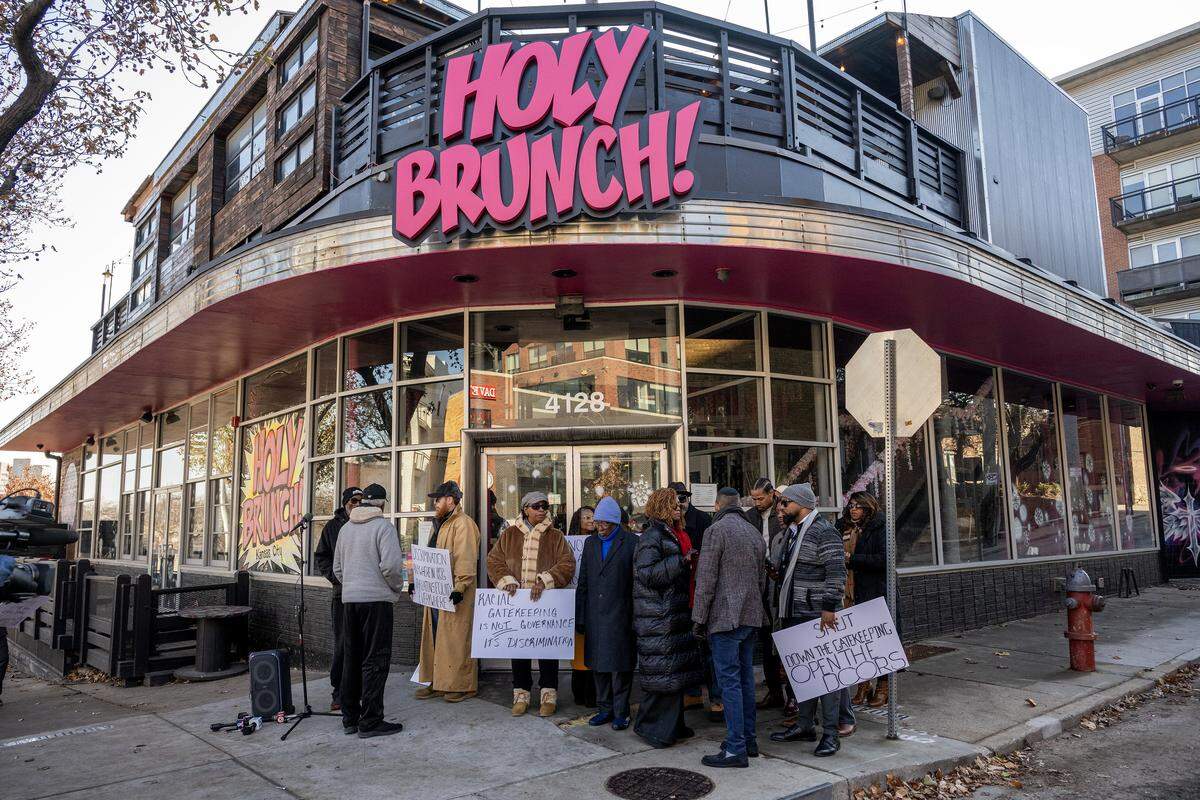 Representatives from the Urban Council and other Black community organizations speak during a press conference outside Holy Brunch addressing allegations of racism in Westport on Monday, Dec. 8, 2025, in Kansas City.