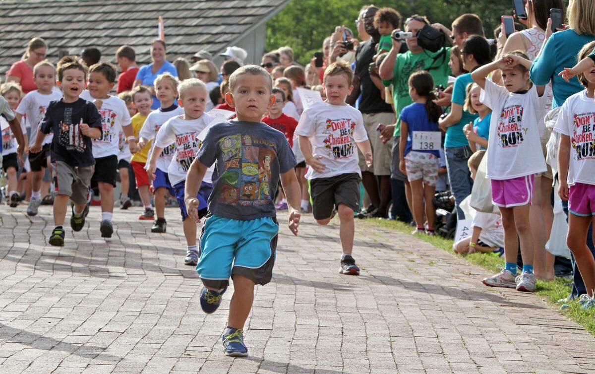 Children, not chickens, race during the annual Georgia’s Chicken Run Saturday at Deanna Rose Children’s Farmstead in Overland Park.