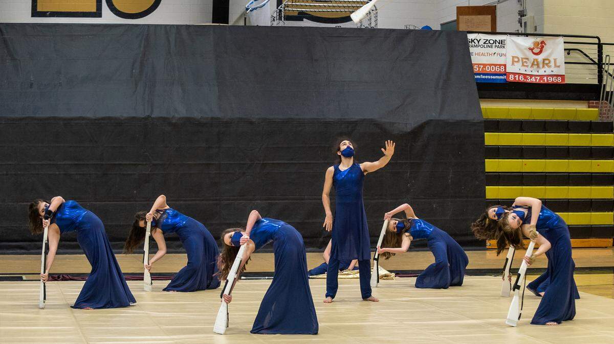 Lee’s Summit North’s Crimson Colors Winter Guard tied for a gold medal in their round of the Mid-Continent Color Guard Association Championships.