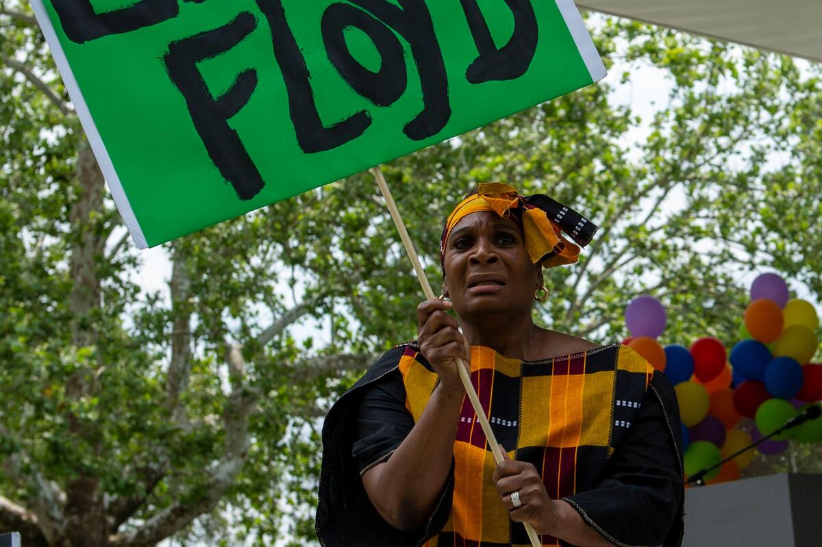 Karen Armstead performs a dance during the second annual Advocacy and Awareness Peace March and Rally on Juneteenth, Saturday, June 19, 2021, at Thompson Park in Overland Park, Kansas. Members of the community gathered to hear speakers and watch performers at the rally.
