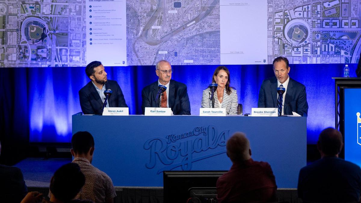 Royals Executive Vice President Sarah Tourville listens as the team’s president of business operations, Brooks Sherman, far right, discussed plans for a new ballpark at a news conference on Aug. 22, 2023, in Kansas City.