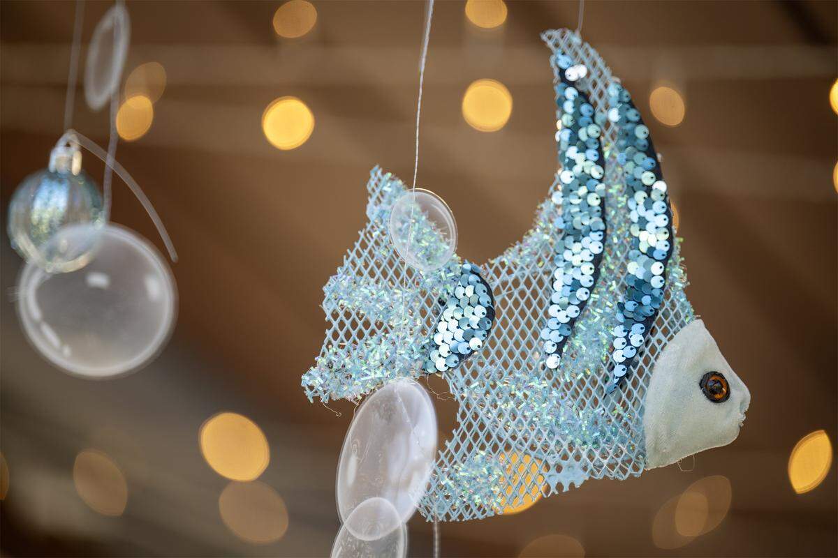 Fish decor in the Fa La La Lagoon cabana is seen on Monday, November 17, 2025, in Kansas City, Kansas. Margaritaville Hotel Kansas City debuts the Frosted Cabanas, a unique holiday pop-up experience opening Wednesday, November 19, 2025. Guests can reserve private, heated cabanas on the pool deck, each featuring festive décor and a relaxed, tropical atmosphere.