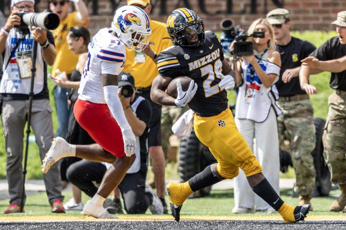 Missouri Tigers running back Ahmad Hardy (29) scores a touchdown in the first quarter during a game against the Kansas Jayhawks at Faurot Field at Memorial Stadium on Saturday, Sept. 6, 2025, in Columbia .
