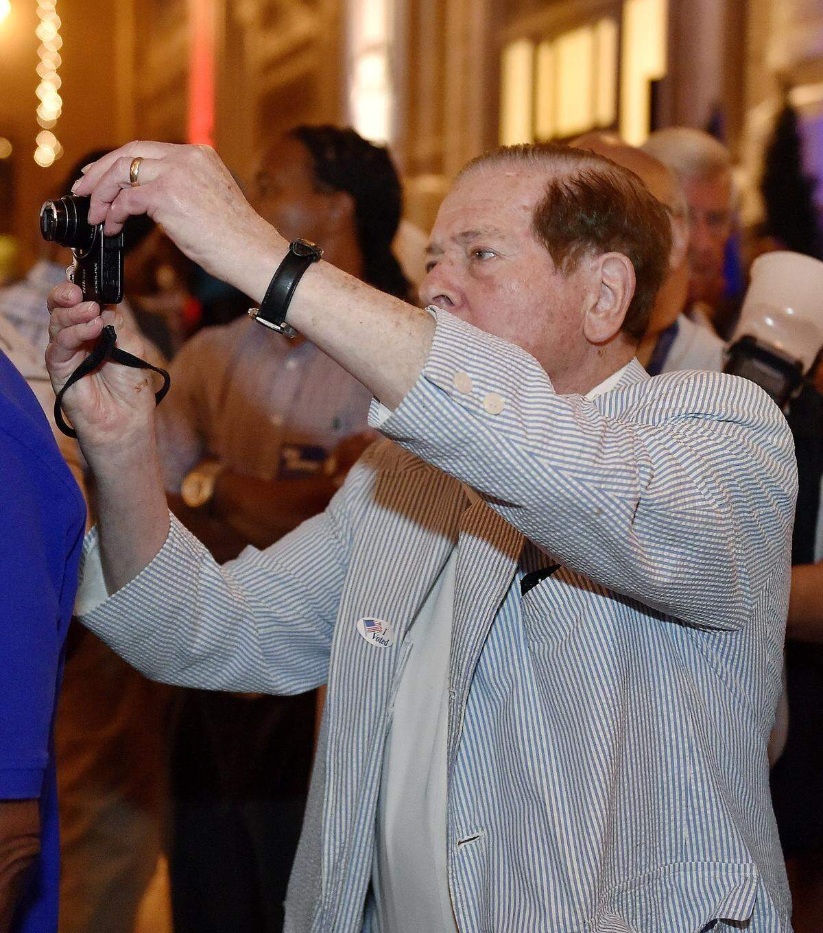 Former Mayor Richard Berkley takes a photo of Sly James while James was being interviewed at an election watch party for James’ mayoral bid in 2015. Berkley was known for having a camera with him all of the time to take and share photos of the people he met.