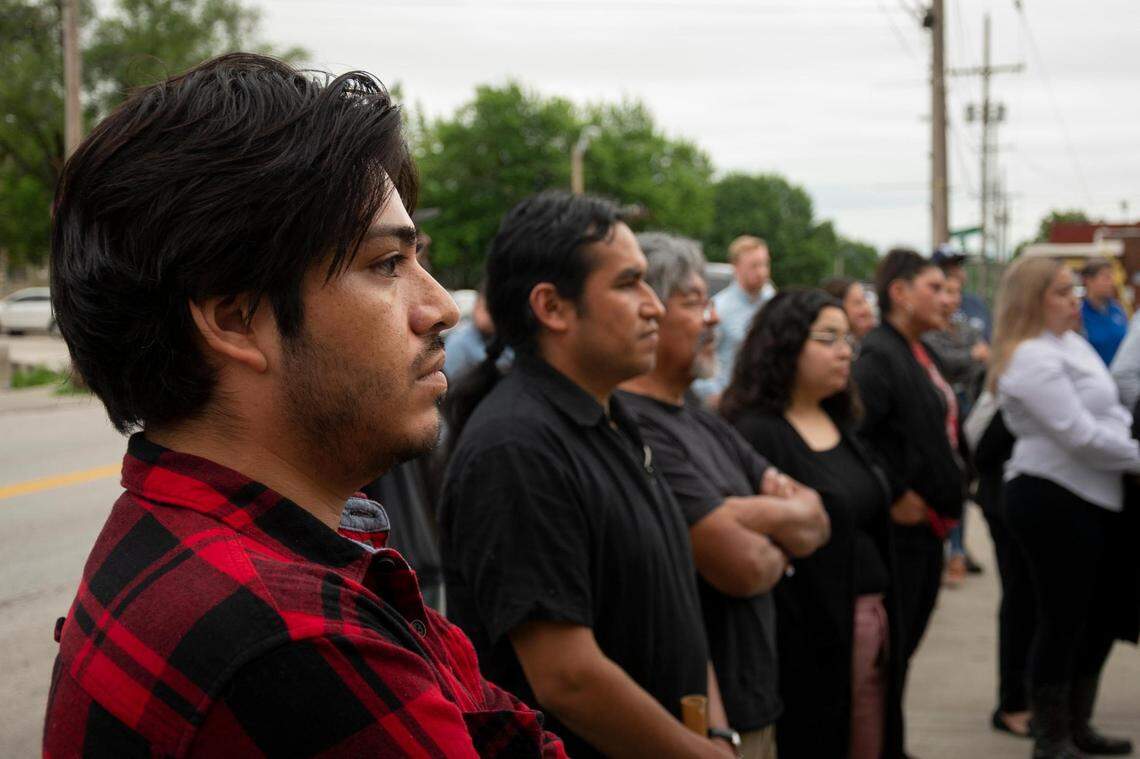 Ivan Ramirez, left, and other community member gather at Latinx Education Collaborative for a vigil to honor the lives of children lost through violence in schools, including those killed in Uvalde, Texas, last week. The vigil was held Tuesday, May 31, 2022, in the Pendleton Heights neighborhood in Kansas City.