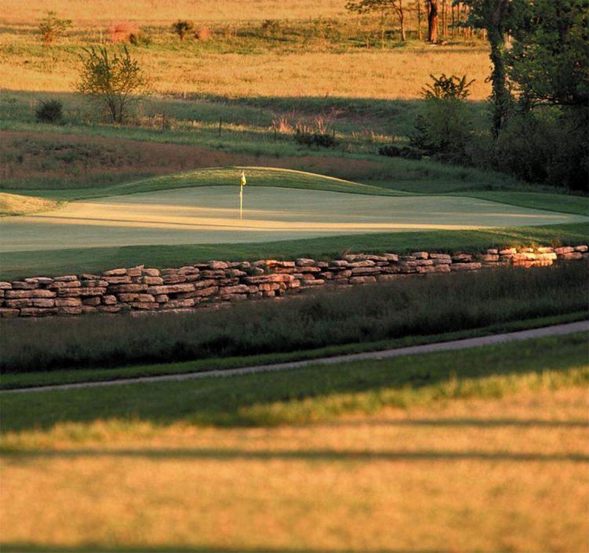Special Section. Golf 2006. Great 18! CUTLINE Golfers face having a large number on their scorecard if they miss the green with their tee shot on the par-3 17th at Shoal Creek. PHOTO COURTESY OF SHOAL CREEK
