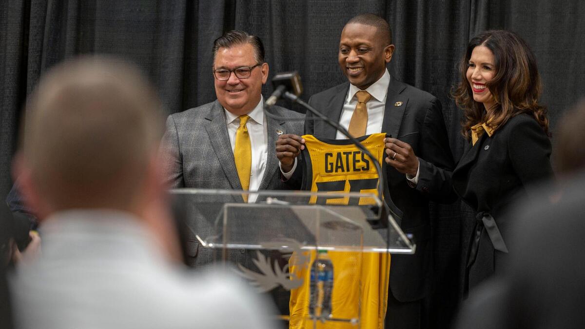 University of Missouri Board of Curators, Jeff Layman, left, head coach Dennis Gates and director of athletics, Desireé Reed-Francois pose for a photograph during a press conference at Mizzou Arena in the Albrecht Family Practice Facility on Tuesday, March 22, 2022. The University of Missouri announced its new head men’s basketball coach during a press conference.