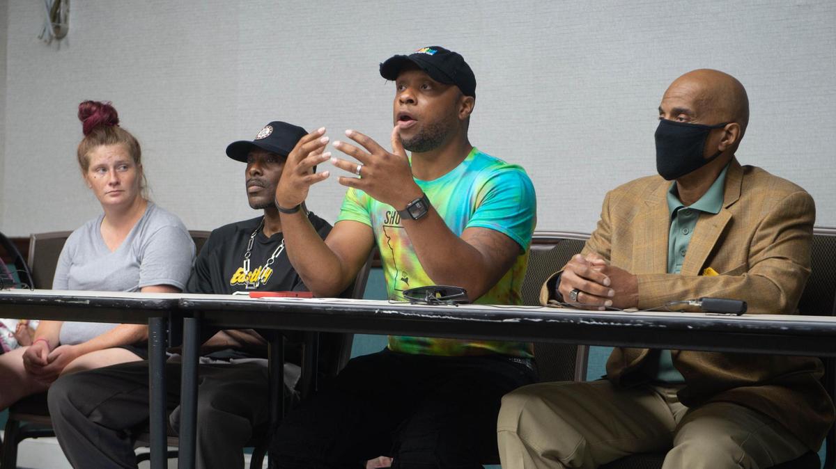 Anton Washington, middle, is pictured in this file photo while speaking at a press conference in the Northland on July 14, 2021.  A federal grand jury subpoena sent to City Hall sought records related to Washington’s organization in 2025. 