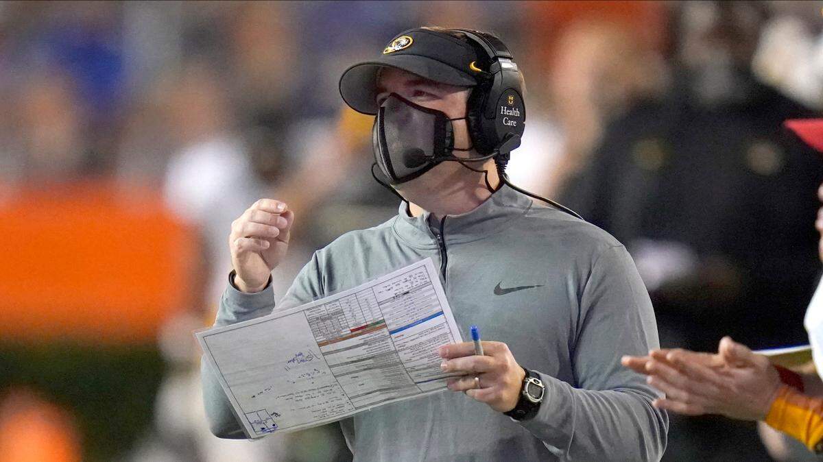Missouri head coach Eliah Drinkwitz watches his team against Florida during the second half of an NCAA college football game, Saturday, Oct. 31, 2020, in Gainesville, Fla. (AP Photo/John Raoux)