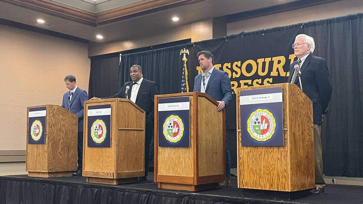 Moderator David Lieb, left, stands on stage with the three candidates for Missouri auditor at a Missouri Press Association candidate forum in Lake Ozark on Friday.