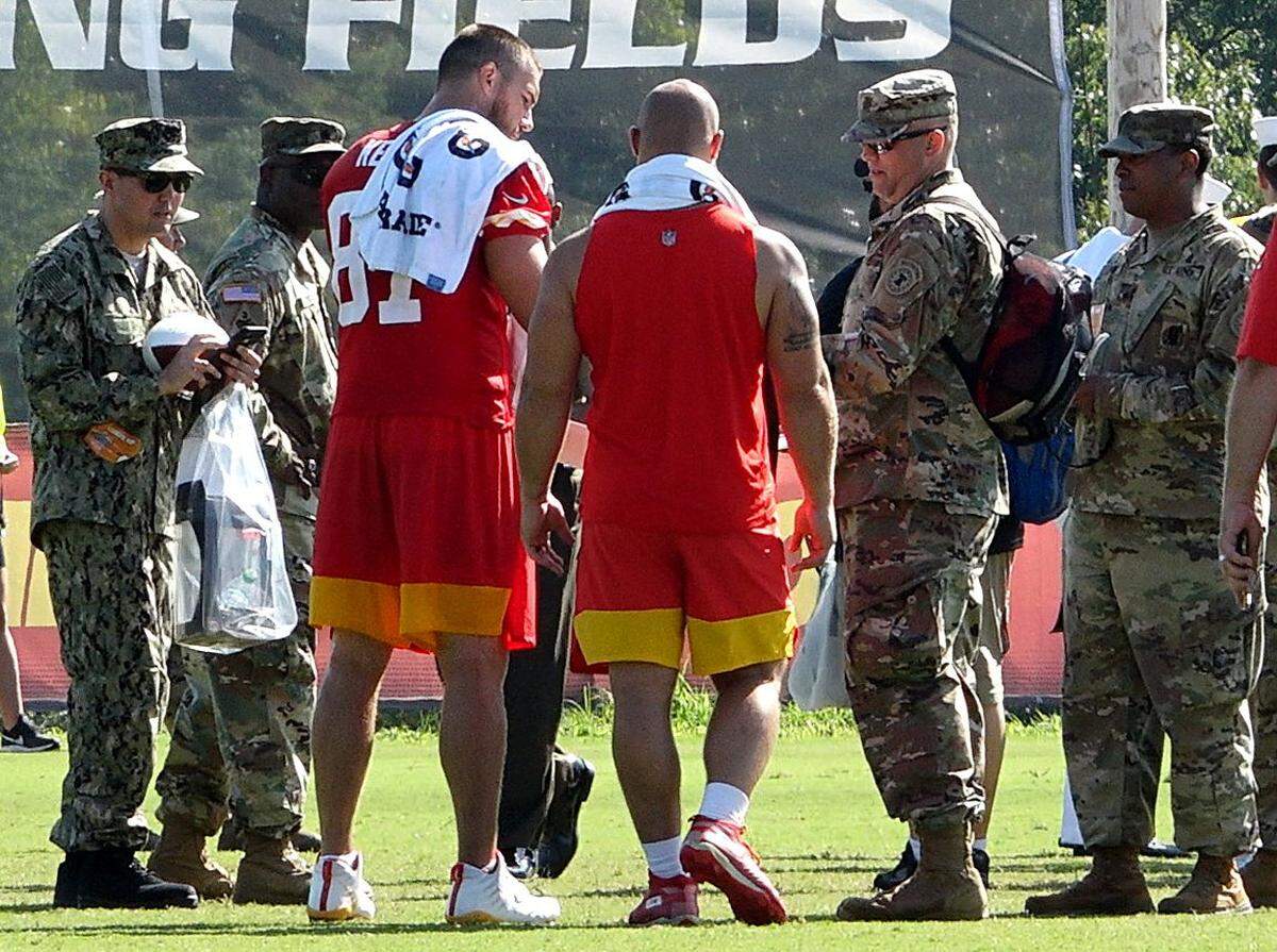 Tight end Travis Kelce (87) and fullback Anthony Sherman sign autographs after practice for military appreciation day. The Kansas City Chiefs wrapped up training camp at Missouri Western State University in St. Joseph, Missouri, Thursday, Aug. 15, 2019.